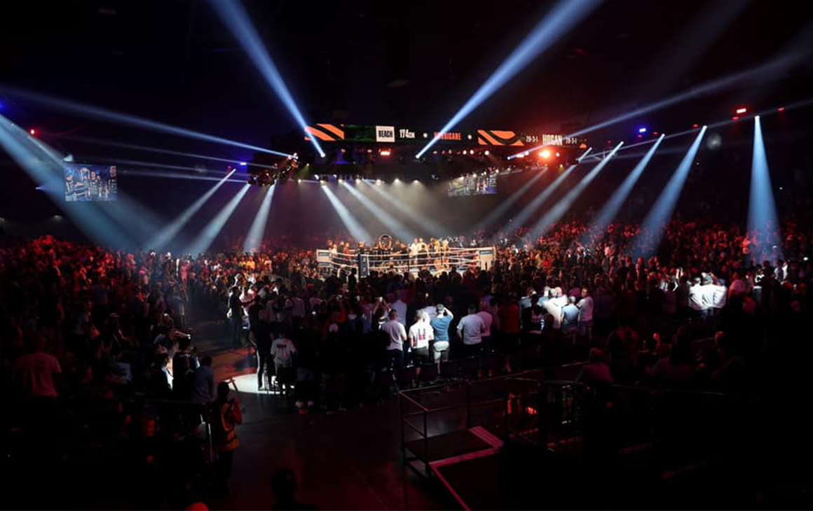 the bright lights of a boxing arena.
