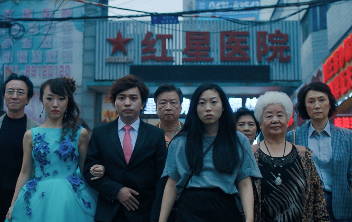 A group of women - young and old - walk down a city street.