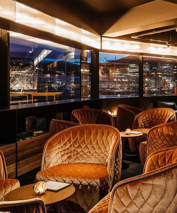 The MACq10, one of the best hotels in Hobart, looks out at the sparkling skyline at night