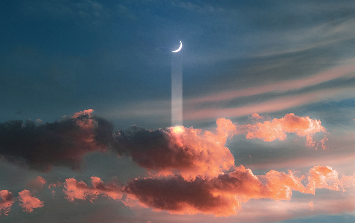 a crescent moon floats above a cluster of pink clouds.