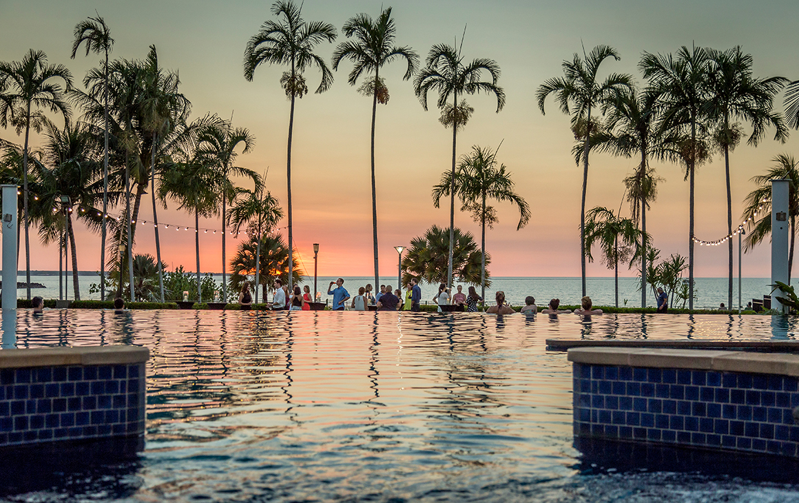 a dusty pink sunset in Darwin from the pool at Mindil Beach Resort