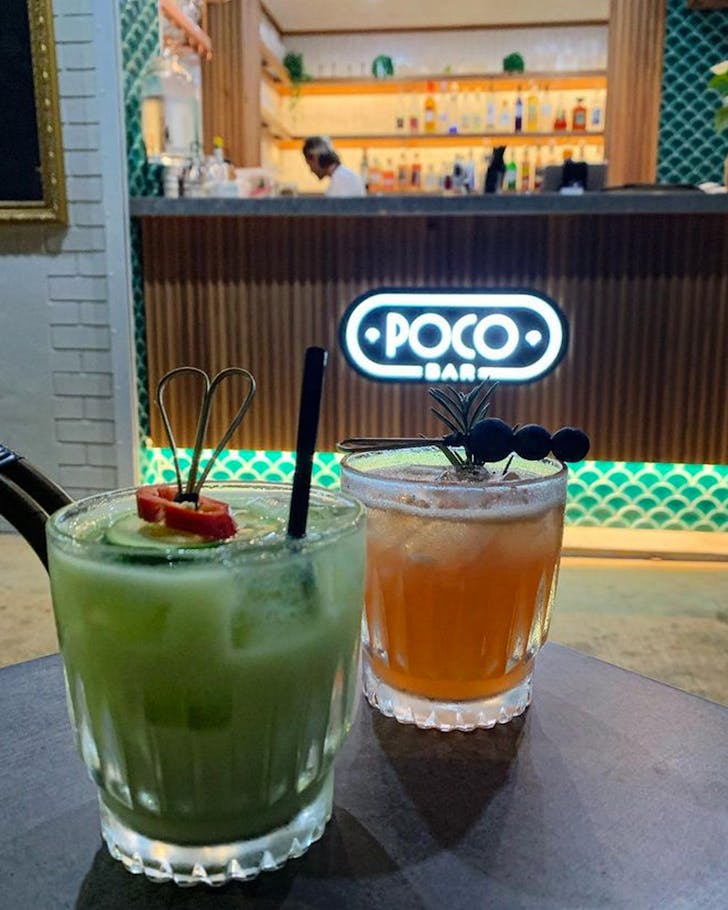 two cocktails on a table