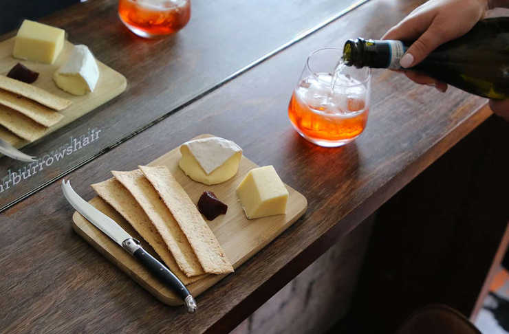 cheese  and wine on table