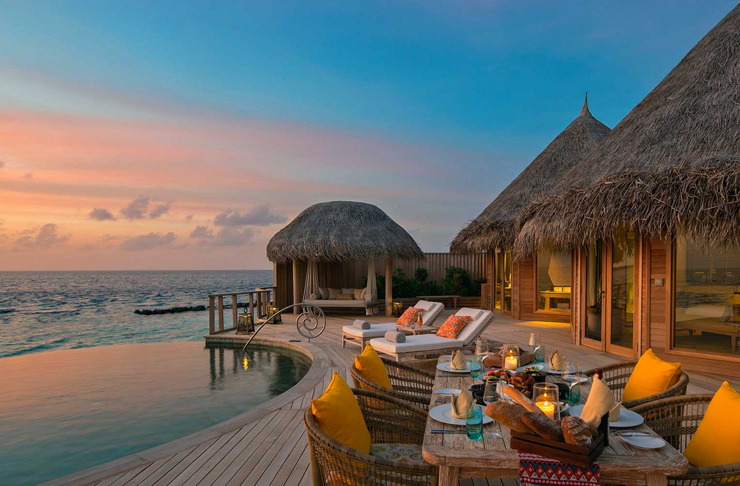 outdoor pool at sunset at the nautilus maldives