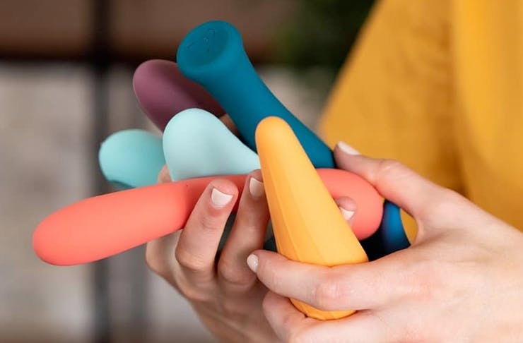 hand holding a number of different coloured and shaped vibrators