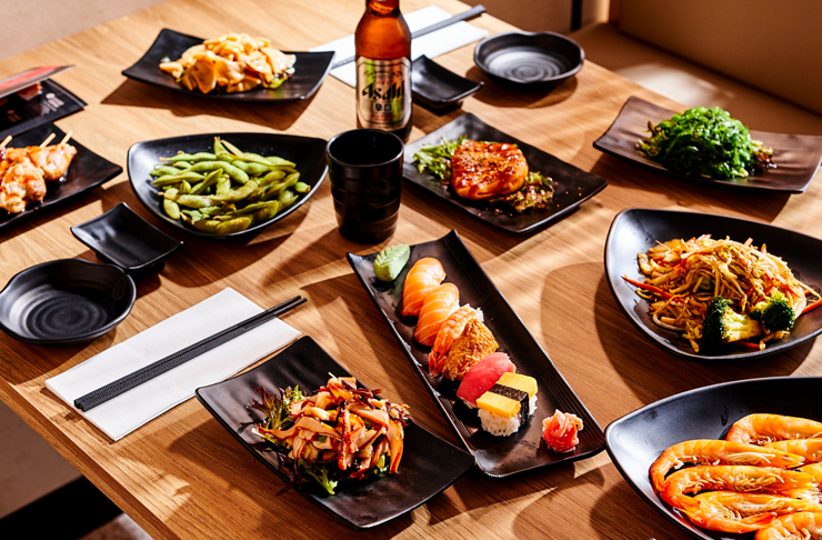 various platters of japanese food