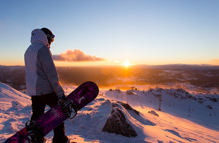 person standing on top of snowy mountain