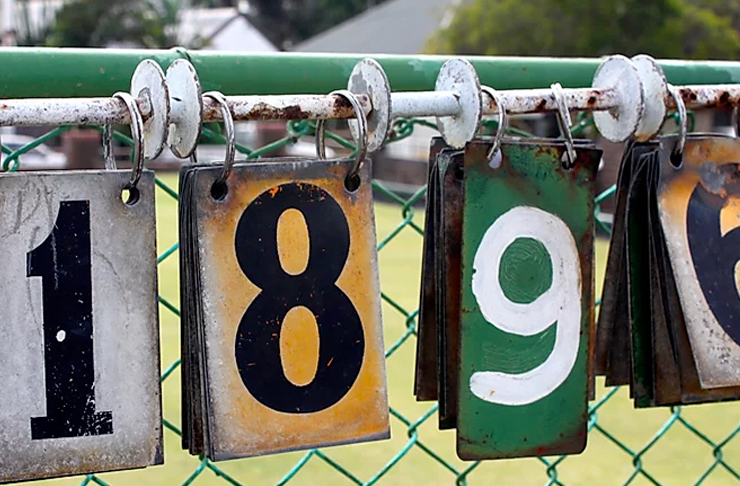 numbers hanging on fence