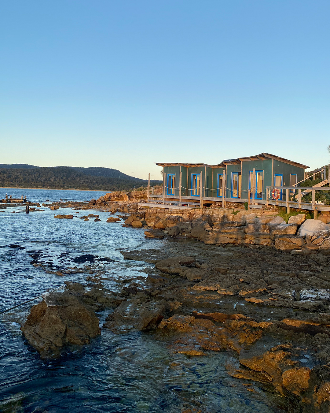 a line up of lakehouses on a private island