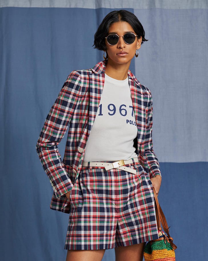 A person wearing a red Polo Ralph Lauren check pant suit over a white t-shirt. 