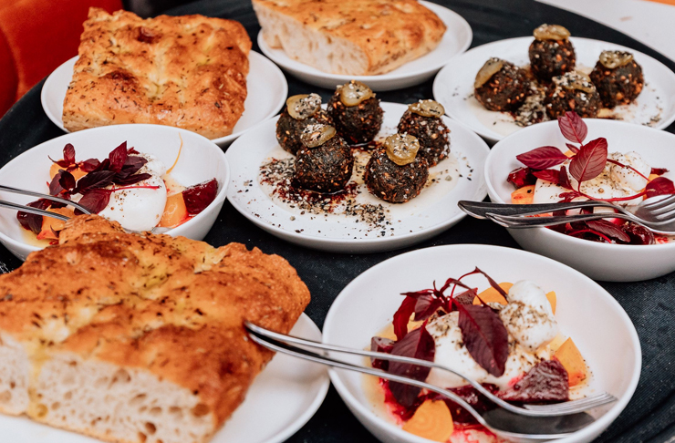 bread and mezze feast on table