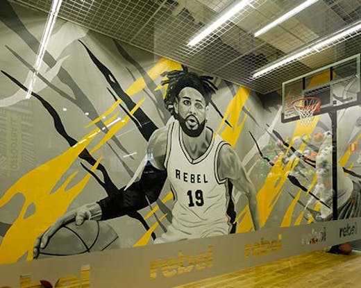basketball court with mural of basketball player painted by James Small