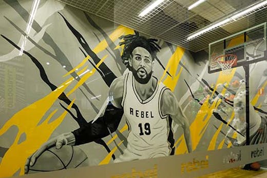 basketball court with mural of basketball player painted by James Small