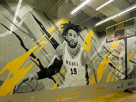 basketball court with mural of basketball player painted by James Small