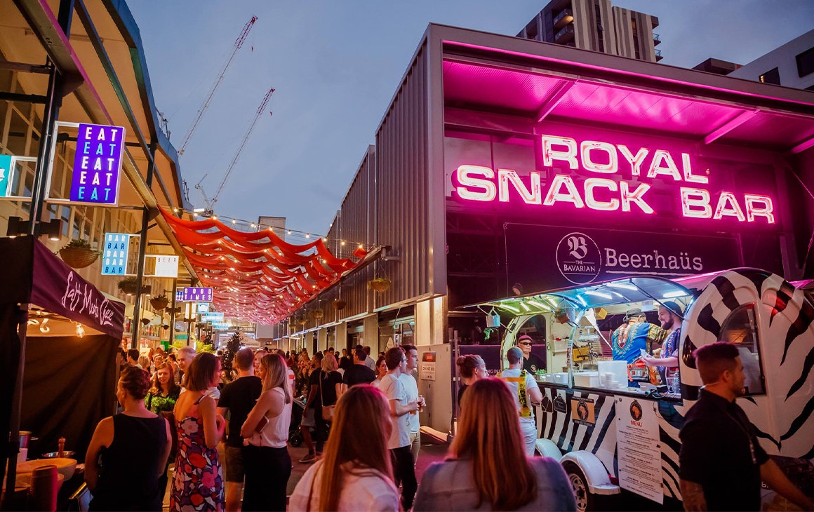 food market stalls with bright neon lights