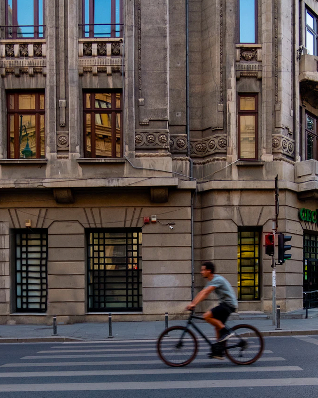 young man cycling through Sydney's CBD