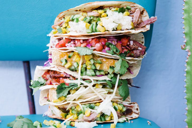 stack of overflowing tacos