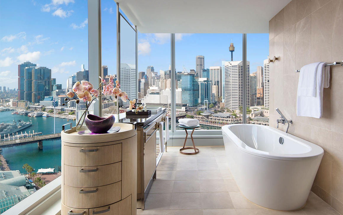 a stunning view of darling harbour from a bathroom at the sofitel