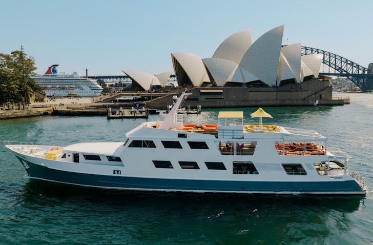a superyacht in sydney harbour on a sunny dat