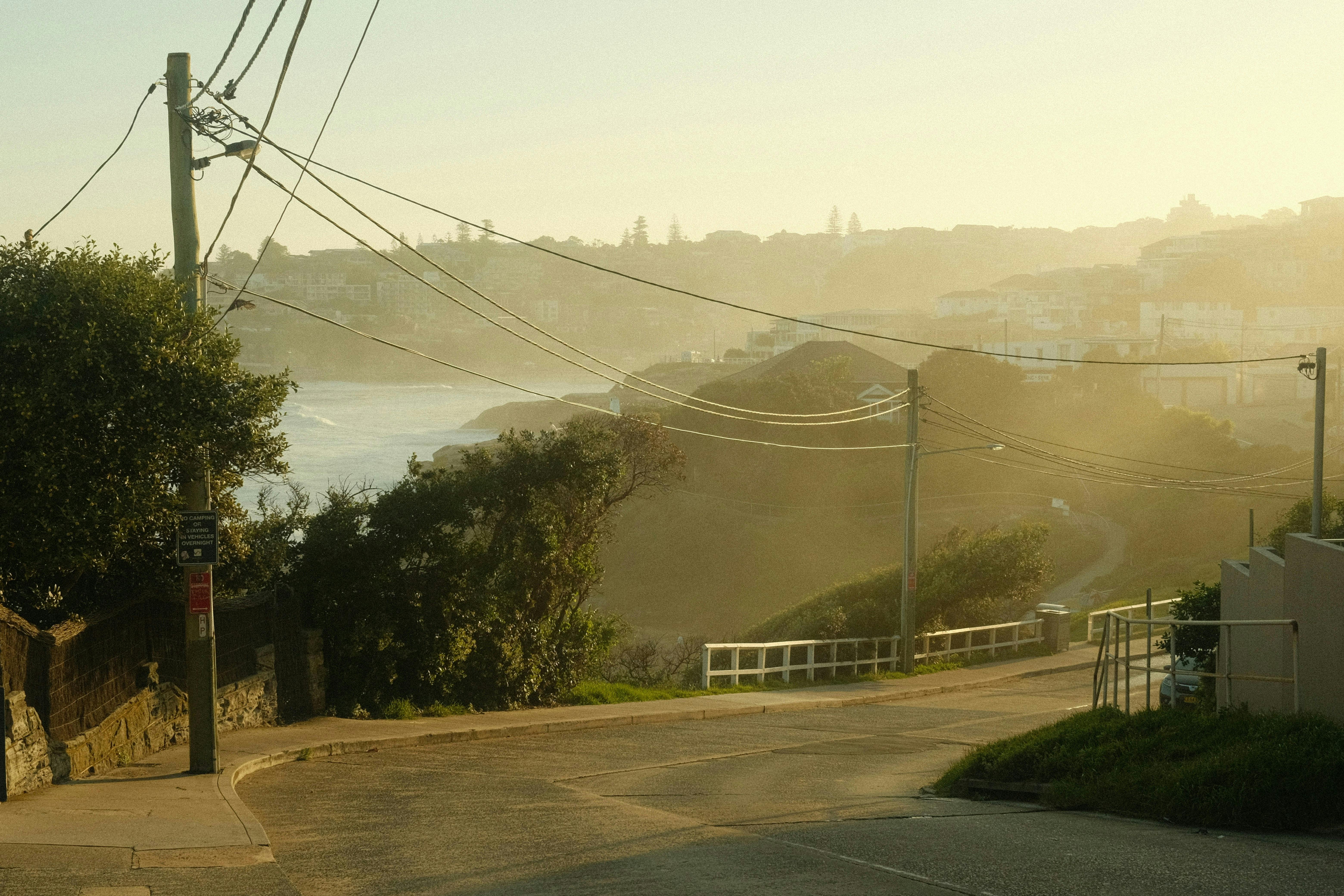 a misty morning on a coastal road with views of the water