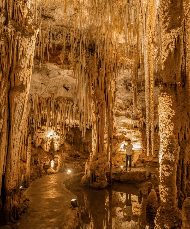 A man walks through Tantanoola Caves