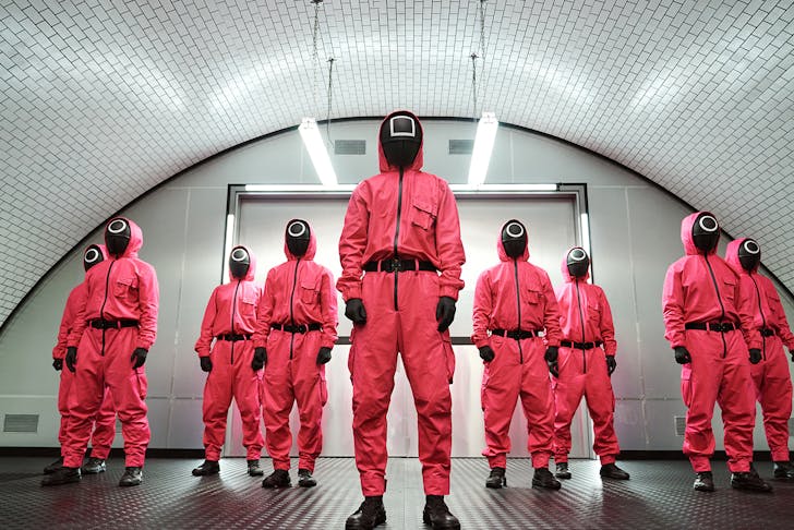 a group of people wearing hazmat suits