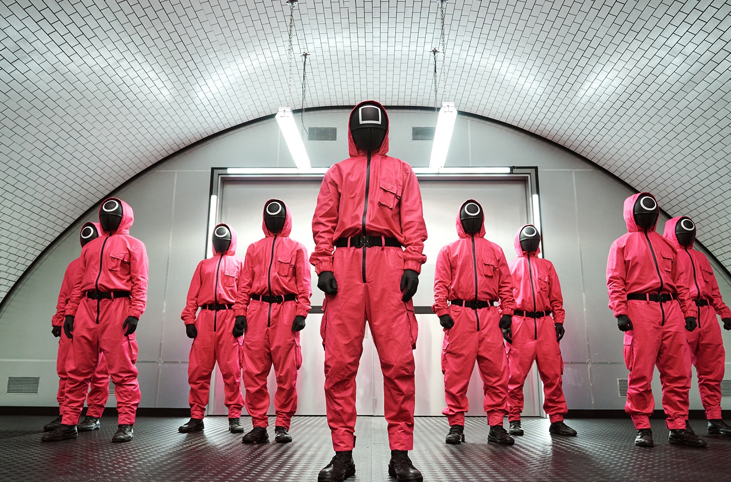 a group of people wearing hazmat suits