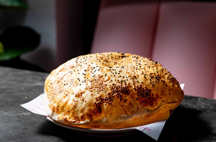 puffy bread on plate in restaurant