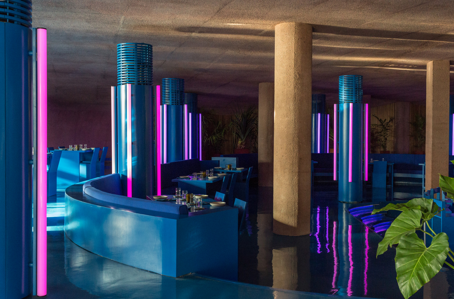 a futuristic restaurant with purple LED lights