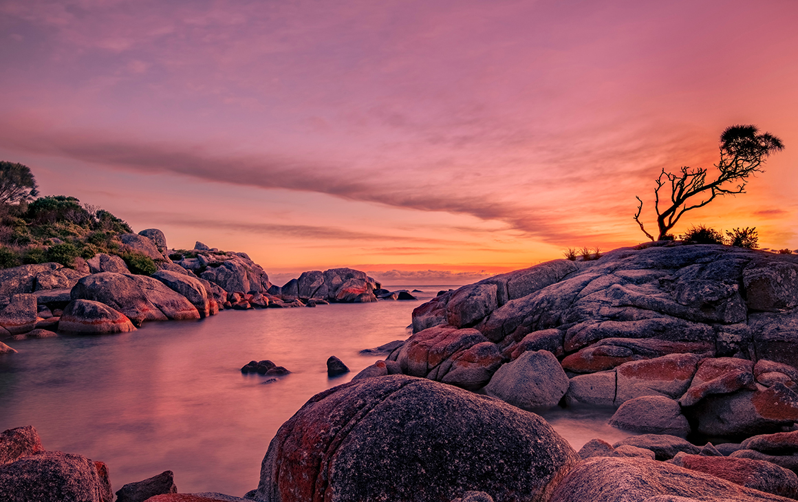A beautiful pink and orange sunset at the Bay of Fires