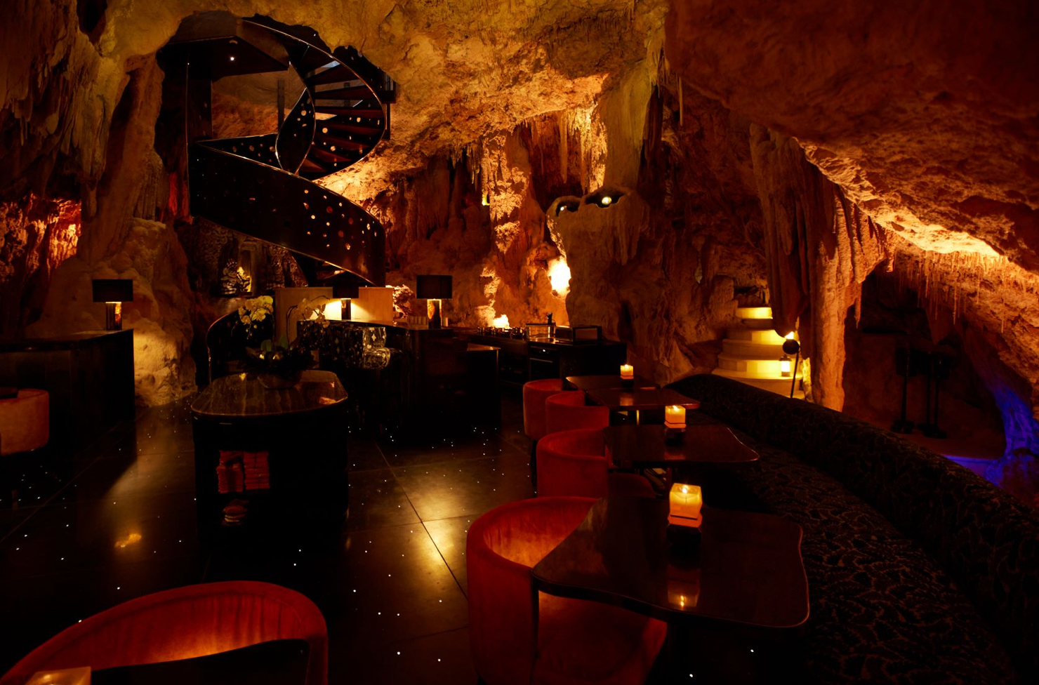 an underground restaurant in a cave with starlights