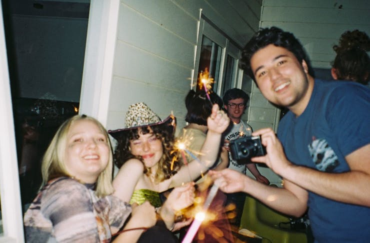 People having fun with sparklers.