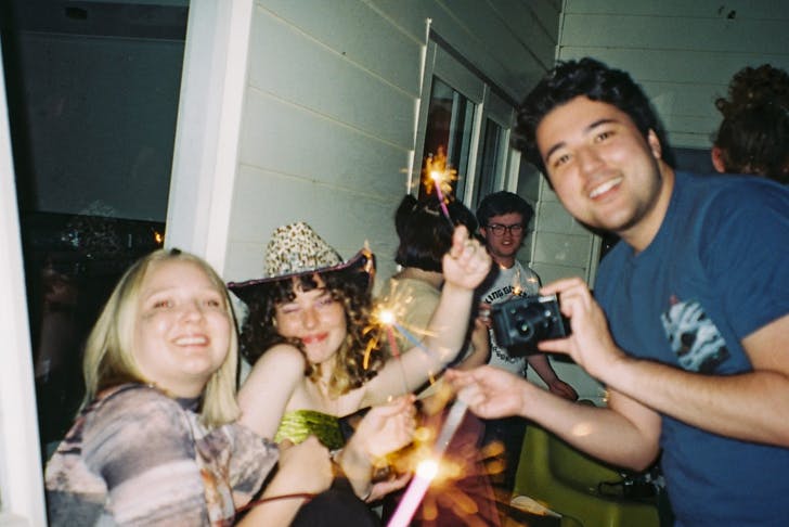 People having fun with sparklers.
