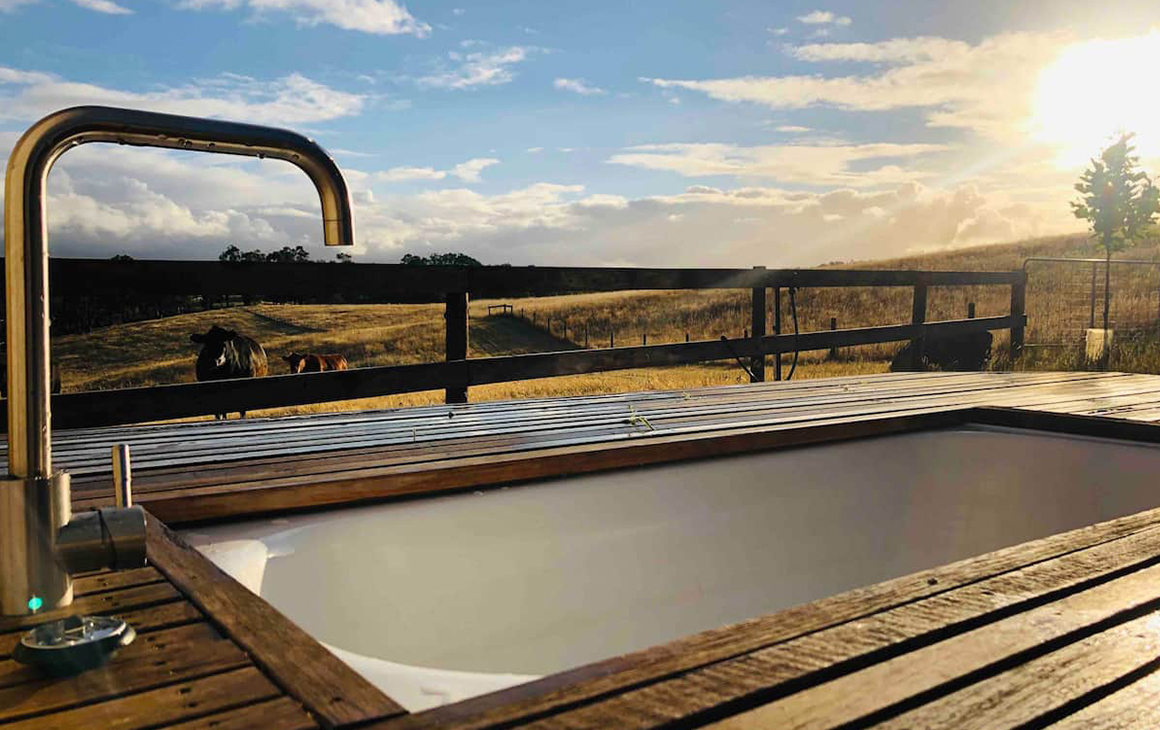 a wooden tub sits in on the edge of Adelaide Hills