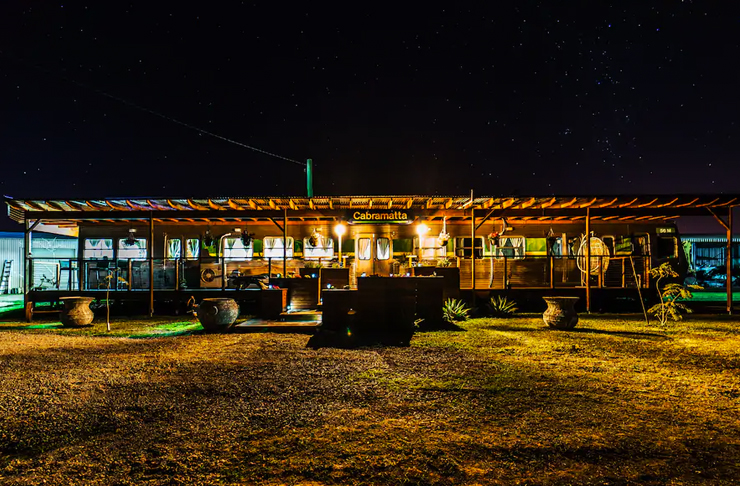 converted train airbnb at night time in australian outback