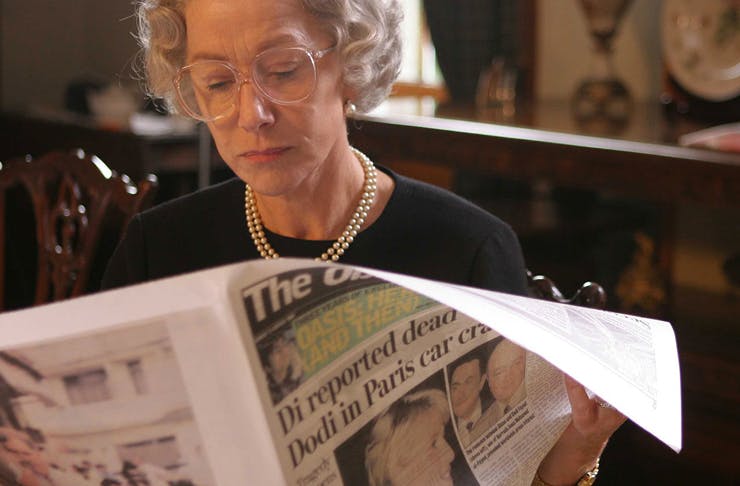 the queen reading the newspaper