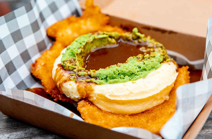 loaded schnitzel with pea mash and gravy