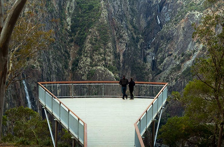 two people standing on the edge of new lookout at wollombombi lookout in NSW