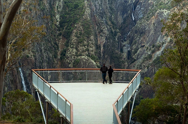 two people standing on the edge of new lookout at wollombombi lookout in NSW